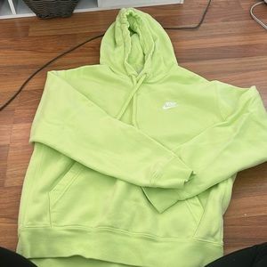 Lime green Nike hoodie fits kid or teen